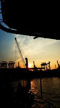 Container ships loading and discharging at port. Stock Photos