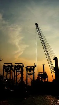 Container ships loading and discharging at port. Stock Photos