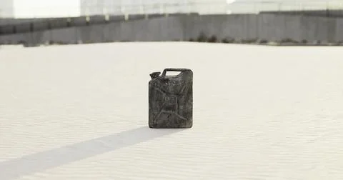 Container sitting alone on sandy surface in an empty outdoor area Illustrazione stock