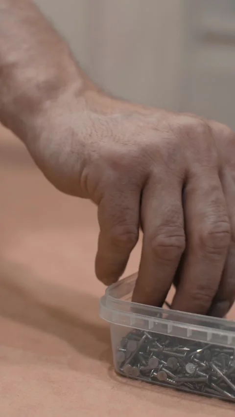 Container small metal nails Stock Footage 303384970