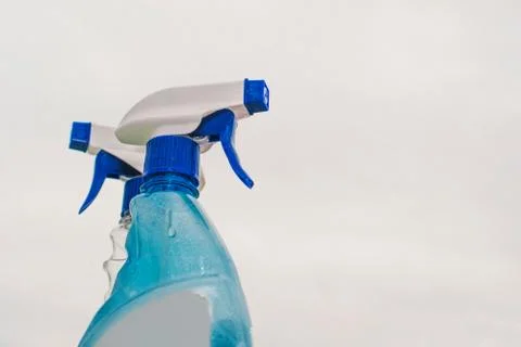 Container with a sprayer for washing windows Stock Photos