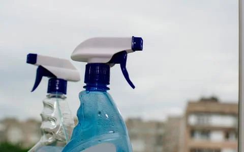 Container with a sprayer for washing windows Stock Photos