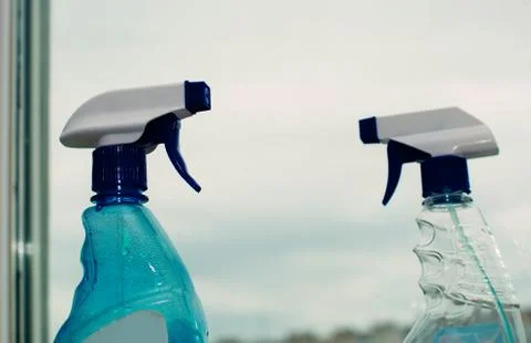 Container with a sprayer for washing windows Stock Photos