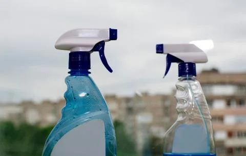Container with a sprayer for washing windows Stock Photos