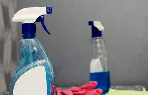 Container with a sprayer for washing windows Stock Photos