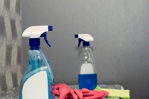 Container with a sprayer for washing windows Stock Photos