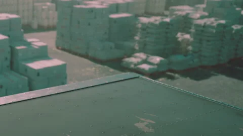 Container stacks in a busy shipping yard during the day Stock Footage 344273109