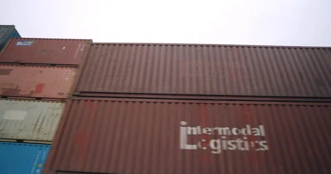 Container stacks rise under gloomy sky in industrial port Stock-Footage 319831840