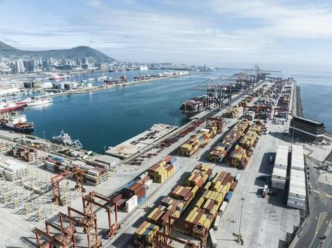 Container stacks waiting for loading onto vessels in Cape Town harbor Stock Photos