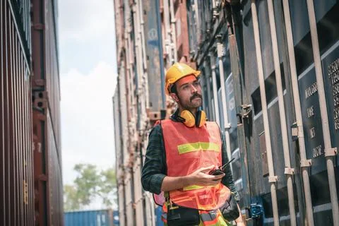 Container Supervisor Control Import/Export While Inspecting Containers Box in Stock Photos