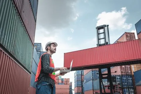 Container Supervisor Control Import/Export While Inspecting Containers Box in Stock Photos