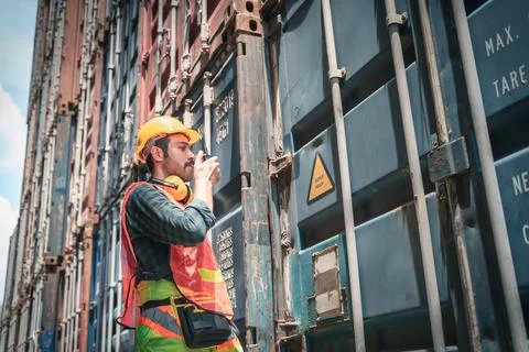Container Supervisor Control Import/Export While Inspecting Containers Box in Stock Photos