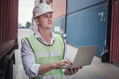 Container Supervisor Control Import/Export While Inspecting Containers Box in Stock Photos