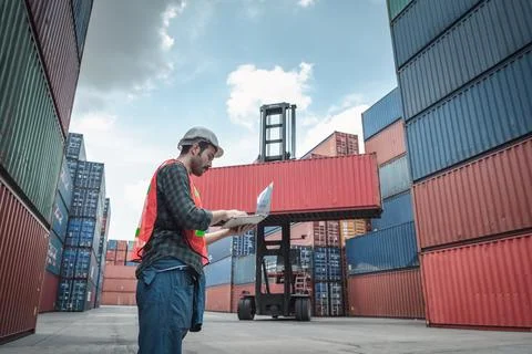 Container Supervisor Control Import/Export While Inspecting Containers Box in Stock Photos