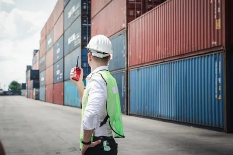Container Supervisor Control Import/Export While Inspecting Containers Box in Stock Photos
