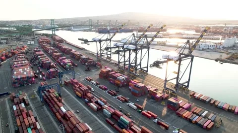 Container Terminal Along Harbor Channel, 4K Orbit Stock Footage 160313483
