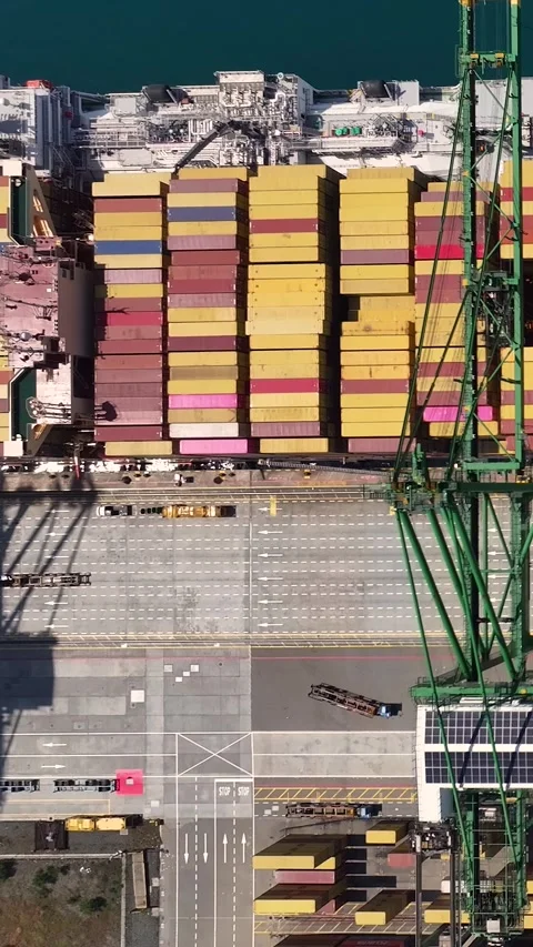 A container terminal with a large container ship being loaded and unloaded 스톡 동영상 341837954