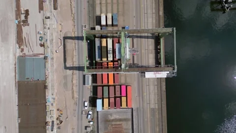 Container terminal logistic loading port cranes. Best aerial view flight drone 動画素材 310723239