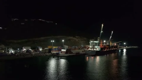 Container terminal in night Sint Maarten port, loading cargo to container ship Video stock 236511043