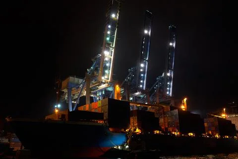 Container terminal with ship at night Stock Photos