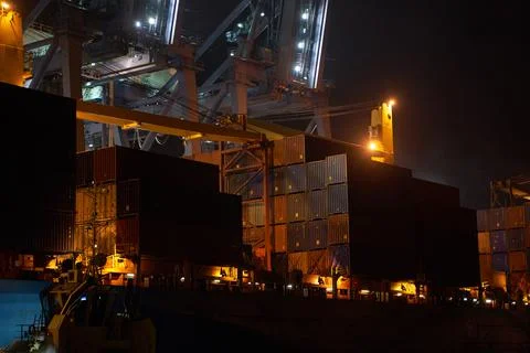 Container terminal with ship at night Stock Photos