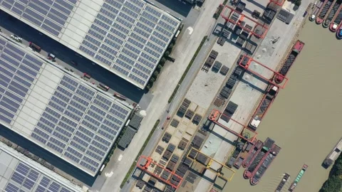 Container terminal with solar panels on factroy rooftop Stock Footage 166232050