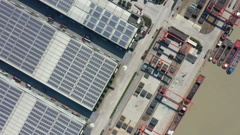 Container terminal with solar panels on factroy rooftop Video stock 166232077
