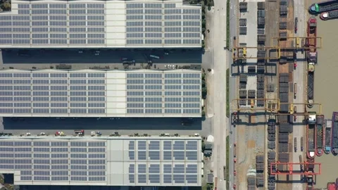 Container terminal with solar panels on factroy rooftop Stock Footage 166232079