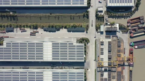 Container terminal with solar panels on factroy rooftop Stock Footage 166232181