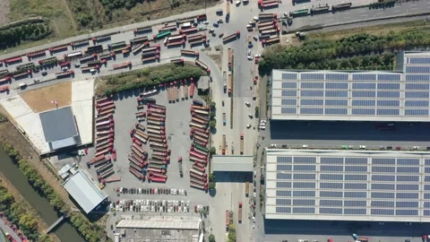 Container terminal with solar panels on factroy rooftop Stock Footage 166232345