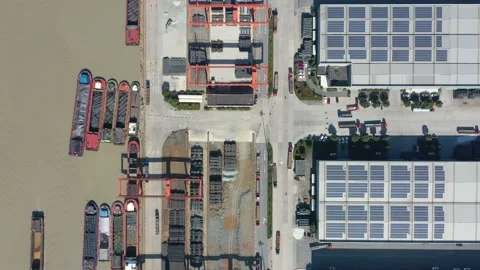 Container terminal with solar panels on factroy rooftop Stock Footage 166233962