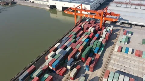 Container terminal with solar panels on factroy rooftop Stock Footage 166387656