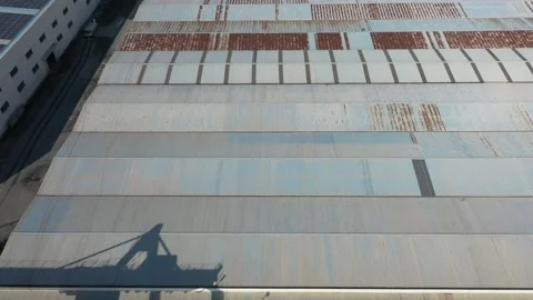 Container terminal with solar panels on factroy rooftop Stock Footage 166388045