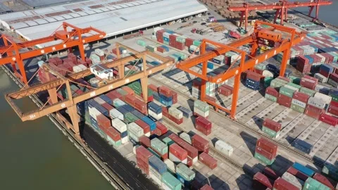 Container terminal with solar panels on factroy rooftop Stock Footage 166388258