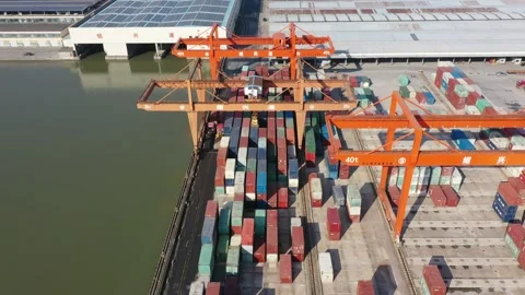 Container terminal with solar panels on factroy rooftop Stock Footage 166388271