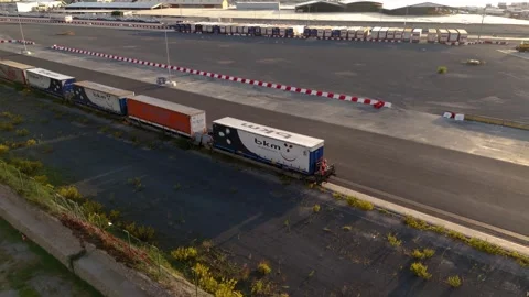 Container Trailers on Rail Wagons at Expansive Freight Terminal Stock Footage 337982294