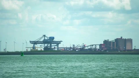 Container transhipment port + transhipment cranes Stock Footage 131649093