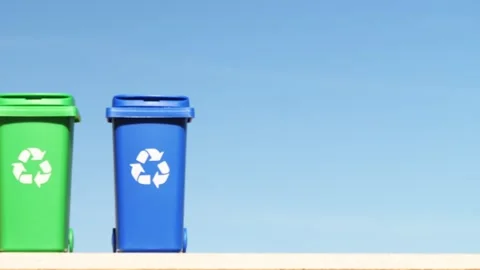 Container trash bin for recycling on blue sky background. Yellow, green, blue Stock Footage 263898657
