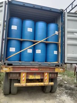Container truck loading drums Stock Photos