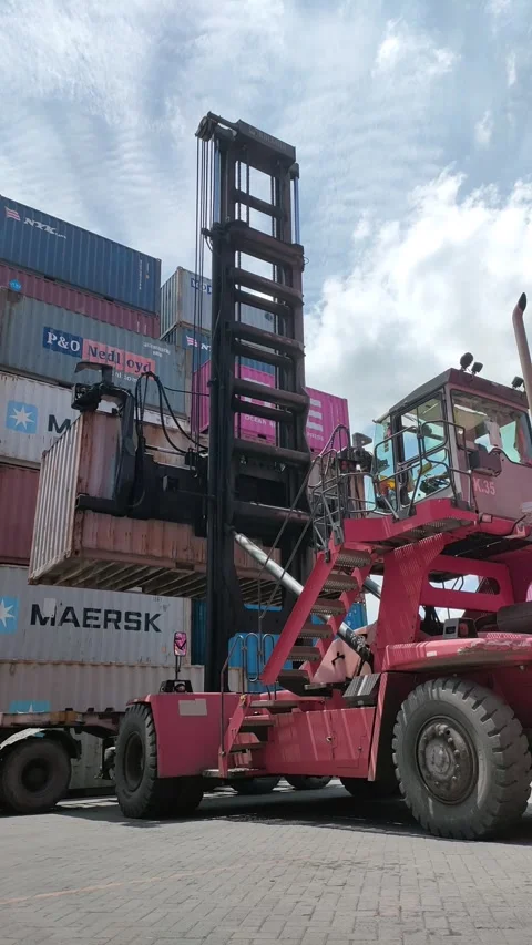 Container truck-Red side loader managing cargo containers Stock Footage 296960824
