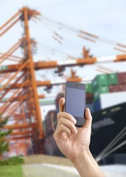 Container vessel and a smartphone Stock Photos