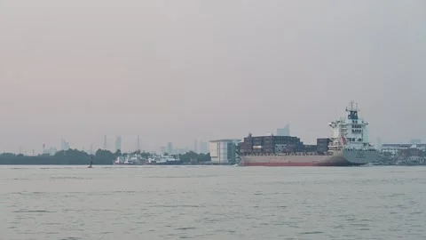 Container vessel crosses wide Samut Prakan river Video stock 339863916
