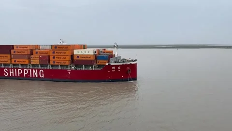 Container Vessel Guided by Tug Boat on Open Water Stock Footage 343037503