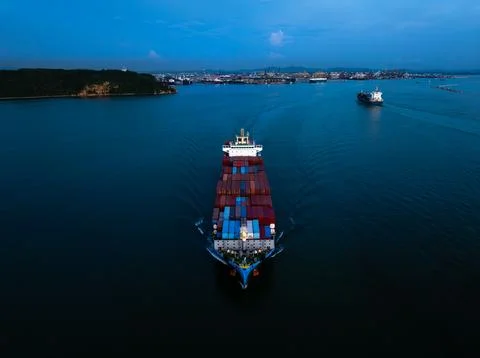Container Vessel Navigating Coastal Waters Toward Major Industrial Port At Du 스톡 사진