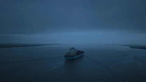 Container vessel sailing on Elbe River under soft twilight sky Stock Footage 320245699