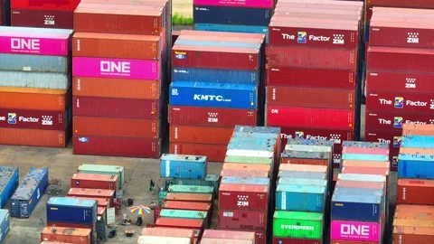 Container yard from above: A bustling hive of activity. Video stock 249728200