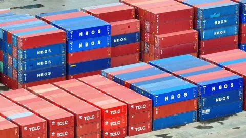 Container yard from above: A bustling hub of stacked shipping containers. Stock Footage 249728598