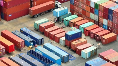 Container yard from above: A bustling maze of stacked containers. Stock Footage 249728597