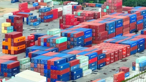 Container yard, a bustling hub of stacked shipping containers. Stockbeeldmateriaal 249728111