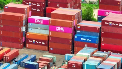 Container yard, a bustling hub of stacked shipping containers. Stock Footage 249728393